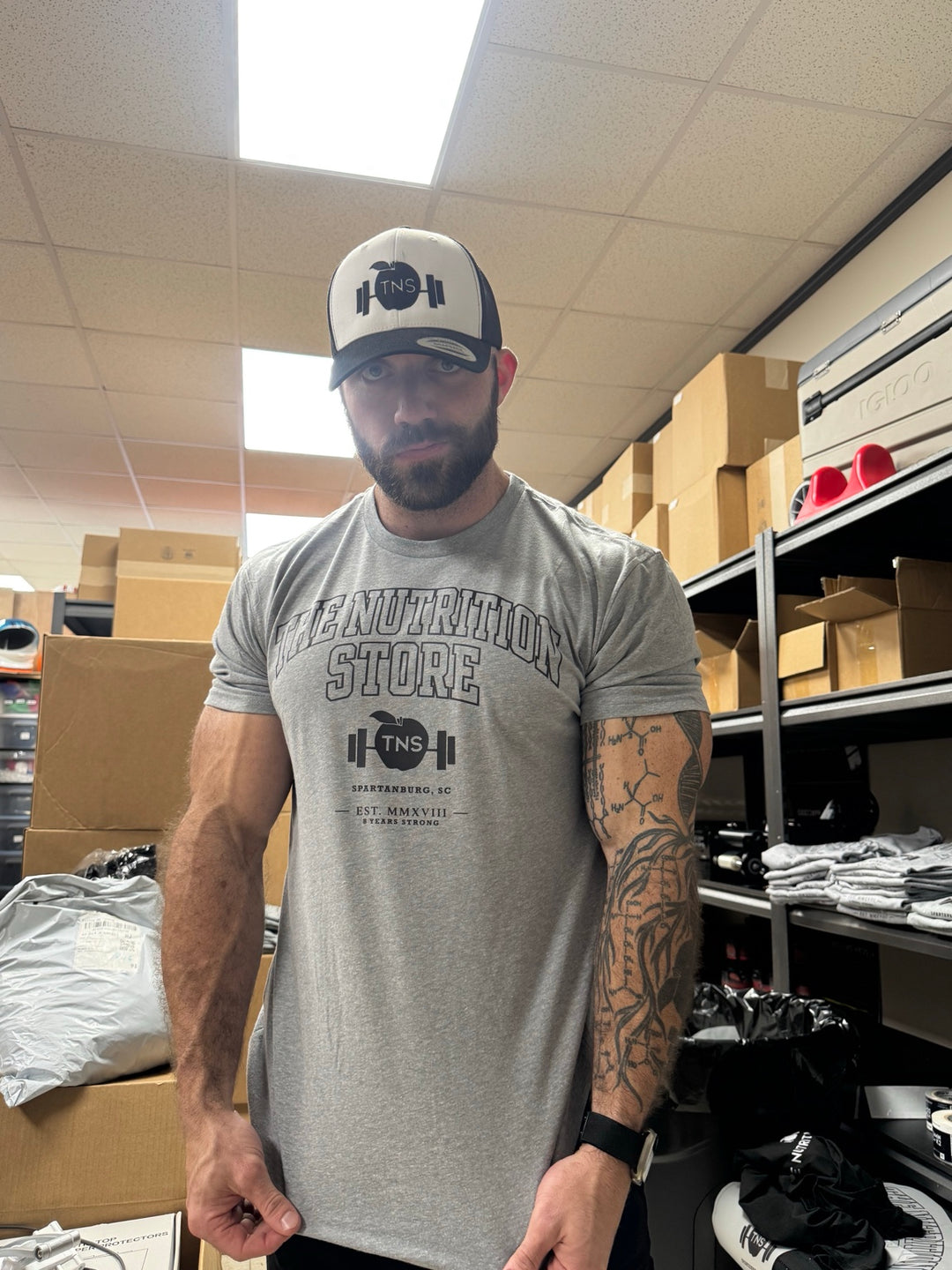 Heather gray collegiate TNS shirt — alternate modeled view