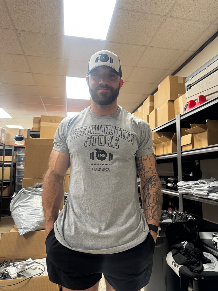Heather gray collegiate TNS shirt modeled at The Nutrition Store